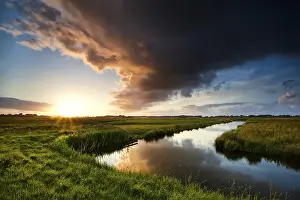 Dutch Countryside Stampe: Storm cloud at dramatic sunset in summertime