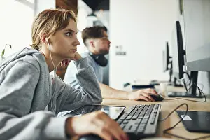 Back To School Stampe: Students learning in computer classroom
