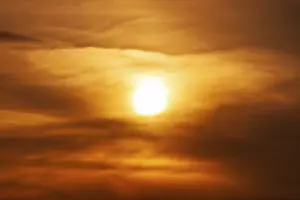 Deserted Evening Sky Stampe: Sun behind cloud cover, sunset