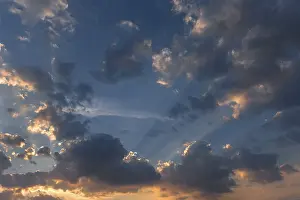 Southern Germany Sunset Stampe: Sun behind the clouds in the evening sky