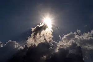 Stormy Weather Stampe: Sun behind dark clouds