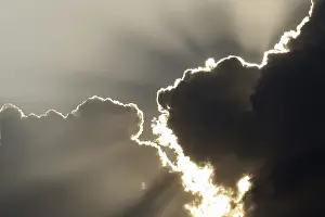 Stormy Weather Stampe: Sun behind storm clouds
