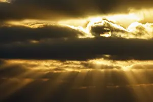 Sunbeams Through Clouds Stampe: Sunbeams shining through clouds