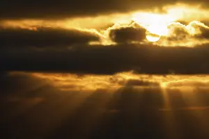 Uninhabited Cloudy Skies Stampe: Sunbeams shining through clouds