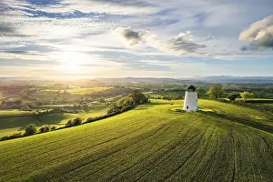 Devon Landscape Stampe: Sunnset over Devon Windmill over Fields and Farms