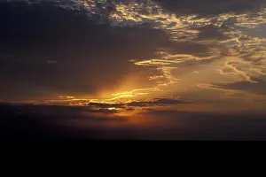 Cloudy Sunset Stampe: Sunset with clouds