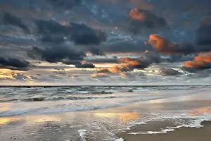 Dutch Evening Sky Stampe: Sunset with clouds on the beach