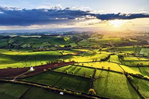 Devon Windmill Sunset Stampe: Sunset of Devon Windmill over Fields and Farms from a drone