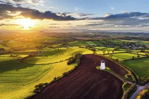 Windmill Landscape Photo Stampe: Sunset of Devon Windmill over Fields and Farms from a drone