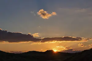 Deserted Evening Sun Scene Stampe: Sunset behind dunes, spring clouds