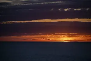Deserted Beach Mallorca Stampe: Sunset over the sea, with dramatic clouds