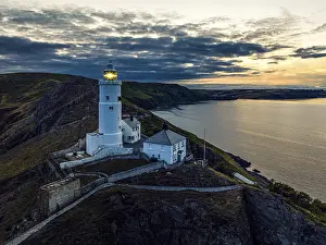 Elevated View Of Devon Coastline Stampe: Sunset over Start Point Lighthouse from a drone