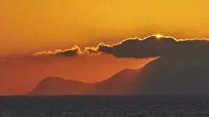 Sicily Sunset Stampe: Sunset, sun disc behind clouds