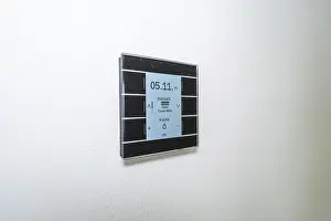 Minimalism In Interior Design Stampe: A switch with a display on a white wall