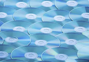 Computer Crime Scene Stampe: A table full of CD-ROMs and DVDs