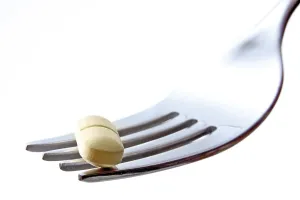 Weight Loss Stampe: Tablets on a fork