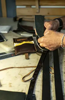Tailor Workshop Stampe: Tailor process leather in workshop