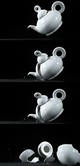 Black Background Photography Stampe: Tea-Pot falling and exploding on Black Background