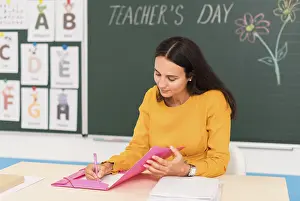Classroom Learning Stampe: Teacher taking notes class