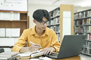 Thoughtful Student Stampe: Thoughtful Young Student Preparing for Class