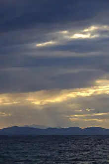 Backlit Cloud Photography Stampe: Thunderclouds at sunset on the beach