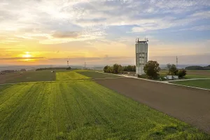 Schwarzwald Evening Atmosphere Stampe: A tower next to fields under an evening sky