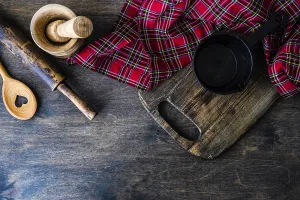 Rustic Kitchen Table Stampe: Useful kitchen cooking stuff on rustic table