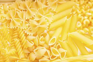 Food Photography Background Stampe: Various pasta types as a background on the table