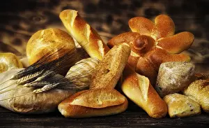 Rustic Bread Stampe: Various types of bread in a rustic setting with warm light