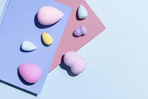 Pastel Color Background Stampe: Top view of an array of multicolored makeup sponges