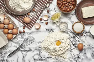 Kitchen Utensils Photography Stampe: Top view of a baking ingredients and kitchenware on a marble background