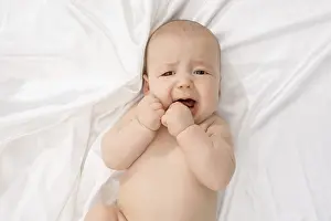 Caucasian Child Portrait Stampe: Top view of child crying while looking at camera