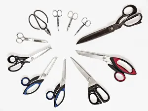 Studio Shot Of Scissors Stampe: Top view of circle from various scissors on white background