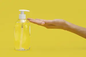 Cleanliness In Kitchen Stampe: Side view hand using liquid soap
