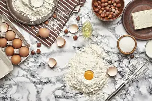 Marble Table Background Stampe: Top view of a kitchenware and baking ingredients on a marble table background