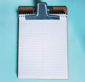 Single Colored Background Image Stampe: Top view of notepad on isolated background
