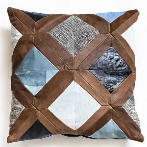 Isolated White Studio Background Stampe: Top view of patchwork leather decorative pillow on white background