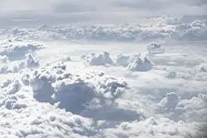 Aviation Photography Stampe: View over towering clouds, cloudy sky