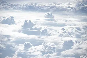 Aviation Industry Stampe: View over towering clouds, cloudy sky