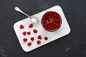 Homemade Jam Recipe Stampe: Top view of transparent pot with raspberry jam