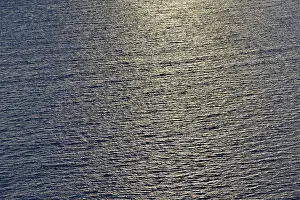 Peaceful Evening Atmosphere Stampe: Water surface with light reflections