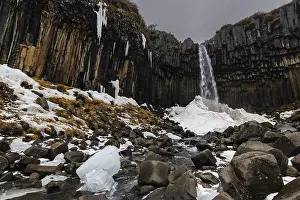 Scandinavian Winter Landscapes Stampe: Waterfall, stream, basalt columns