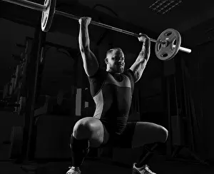 Weightlifting Routine Stampe: Weightlifter does an exercise with a barbell