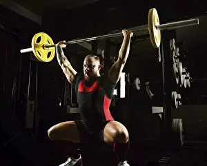 Young Weightlifter Stampe: Weightlifter does an exercise with a barbell