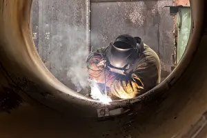 Factory Worker Stampe: Welder at work