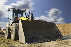 Construction Site Germany Stampe: Wheel loader at sunset, here in the RingstraBe development area (Mutterstadt)