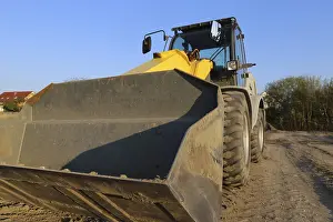 Sunset Construction Site Stampe: Wheel loader at sunset, here in the RingstraBe development area (Mutterstadt)