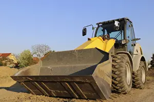 Construction Site Germany Stampe: Wheel loader at sunset, here in the RingstraBe development area (Mutterstadt)