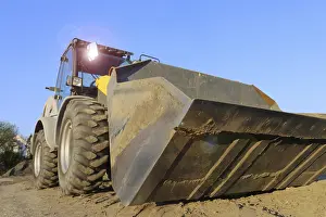 Evening Sun Urban Environment Stampe: Wheel loader at sunset, here in the RingstraBe development area (Mutterstadt)