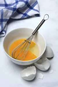 Raw Egg Nutrition Facts Stampe: Whipped egg in shell with whisk, egg shells